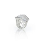 A futuristic rock crystal 'knuckle duster' ring, the fancy cut rectangular rock crystal with twin