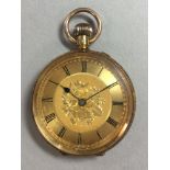 An unsigned continental lady's open faced pocket watch, the gilt floral dial with black Roman