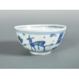 A Ming Wanli bowl, the exterior painted with a hind and birds, the interior with a peach on a