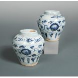 A near pair of provincial Ming jarlets, painted with lotus scrolling above lappet bands, 10.5cm high