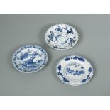 Three Kangxi period small dishes, one painted with two horse-borne figures within three sprays of