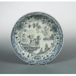 An early 16th century Zheng De period Ming dish, painted with Shoulao riding a deer and two other