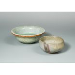 Two bowls, Yuan Dynasty and possibly Ming, the Yuan Jun Bowl with two purple splashes on the