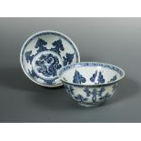 A pair of Ming Dynasty blue and white bowls, the interiors with seven ogee lappets rising from a