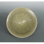 A Northern Song-Jin dynasty Yaozhou celadon moulded conical bowl, unusually large, the deep