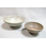 Two provincial Yuan dynasty bowls, one pale green-grey, 15.5cm diameter, the other a small bowl, the