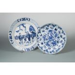Two Kangxi dishes, one painted with two ladies and three children playing by a fence outside a