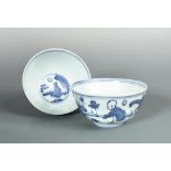 A pair of Ming blue and white bowls, painted in the centre with a seated sage watching the moon, the