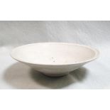 A Song dynasty dish, glazed on a white body, 24cm diameter