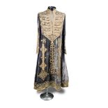 A late 19th century Hazara woman's wedding dress, the velvet gown adorned with couched gold