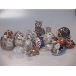 A collection of 16 Royal Crown Derby imari birds and animals to include cats, game birds, badger and