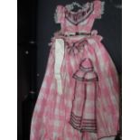 A mid 19th century pink silk ball gown