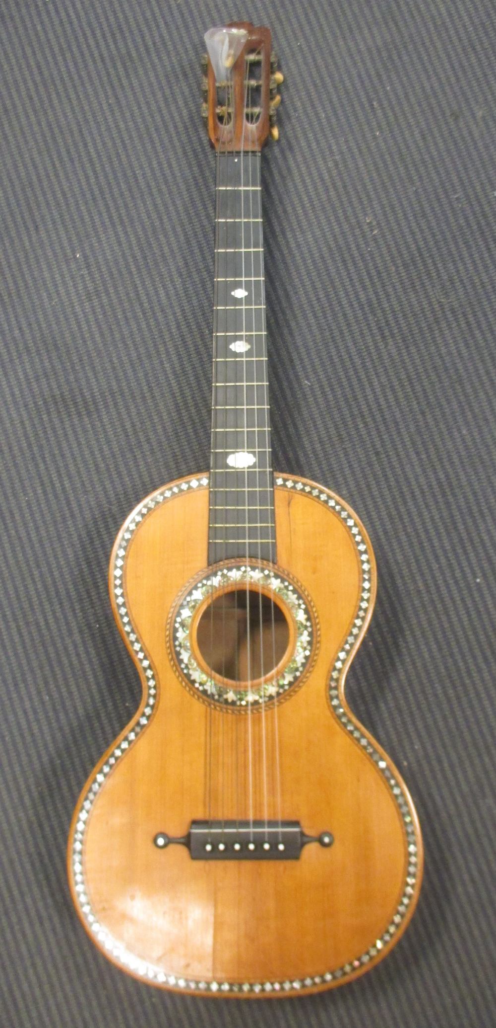 A mid 19th century French inlaid acoustic guitar