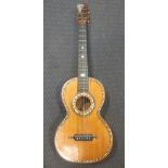 A mid 19th century French inlaid acoustic guitar