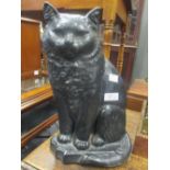 A Victorian black painted iron seated cat doorstop, late 19th/early 20th century, and another