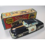 Tinplate friction drive Brimtoy Highway Patrol police car from the Broderick Crawford TV series,