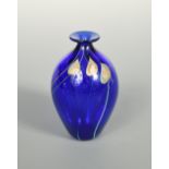 A Rochester Folk Art Guild glass vase, 1981, the bulbous blue glass body decorated with swirling
