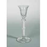 A George III cordial glass, the bell shaped bowl on a double knopped air twist stem, 19.5cm (7.