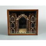 A 19th century shellwork and glitter gothic fantasy diorama, in a glazed mahogany case 31 x 36.50