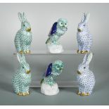 A pair of Herend porcelain models of owls, with green fishnet bodies, 12cm (4.7in) high; two pairs