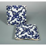 Two mid 16th century Iznik 'Dome of the Rock' tiles, each painted in blue on the diagonal with