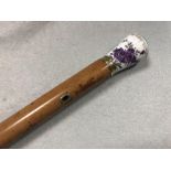 A 19th century malacca walking cane with a Continental porcelain handle, the floral painted handle