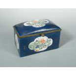 A late 19th century porcelain and metal mounted casket, the powder blue porcelain panels gilt with