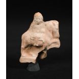 An Egyptian terracotta horse and rider, Roman period, circa 1st Century B.C.-1st Century A.D. 12.
