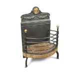 A 19th century brass mounted cast iron fire basket, with leaf cast back and brass roundel mount to a