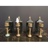 A set of four Regency style toleware and brass mounted wall lights, with gilt flame finials (4) 29cm