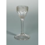 A George III cordial glass, the faceted bowl engraved with fruiting vine, on a plain cylindrical