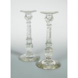 A pair of early 19th century Anglo-Irish candlesticks, of large proportions, the campana shaped