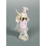 A late 19th century Meissen figure of a lady singing, after a model by J. J. Kaendler, standing