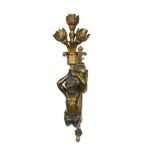 A pair of late 19th or early 20th century bronze wall lights, each as a bronze putto holding aloft