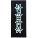 An Islamic Persian mosaic tile panel, the four six pointed star tiles united by three lozenge shaped