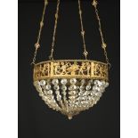 An Edwardian gilt brass framed basket chandelier, decorated with playful cherubic figures to six