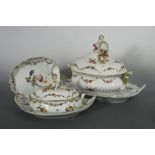 An 18th century Meissen composed dinner service, painted with Deutsche Blumen floral sprays, the