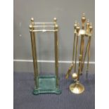 An Edwardian brass stick stand, a copper warming pan, a brass companion set on stand (3)