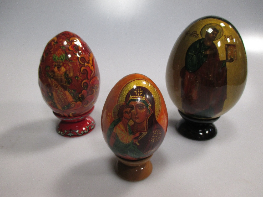 Various Russian painted eggs, all 20th century with religious and cultural scenes with