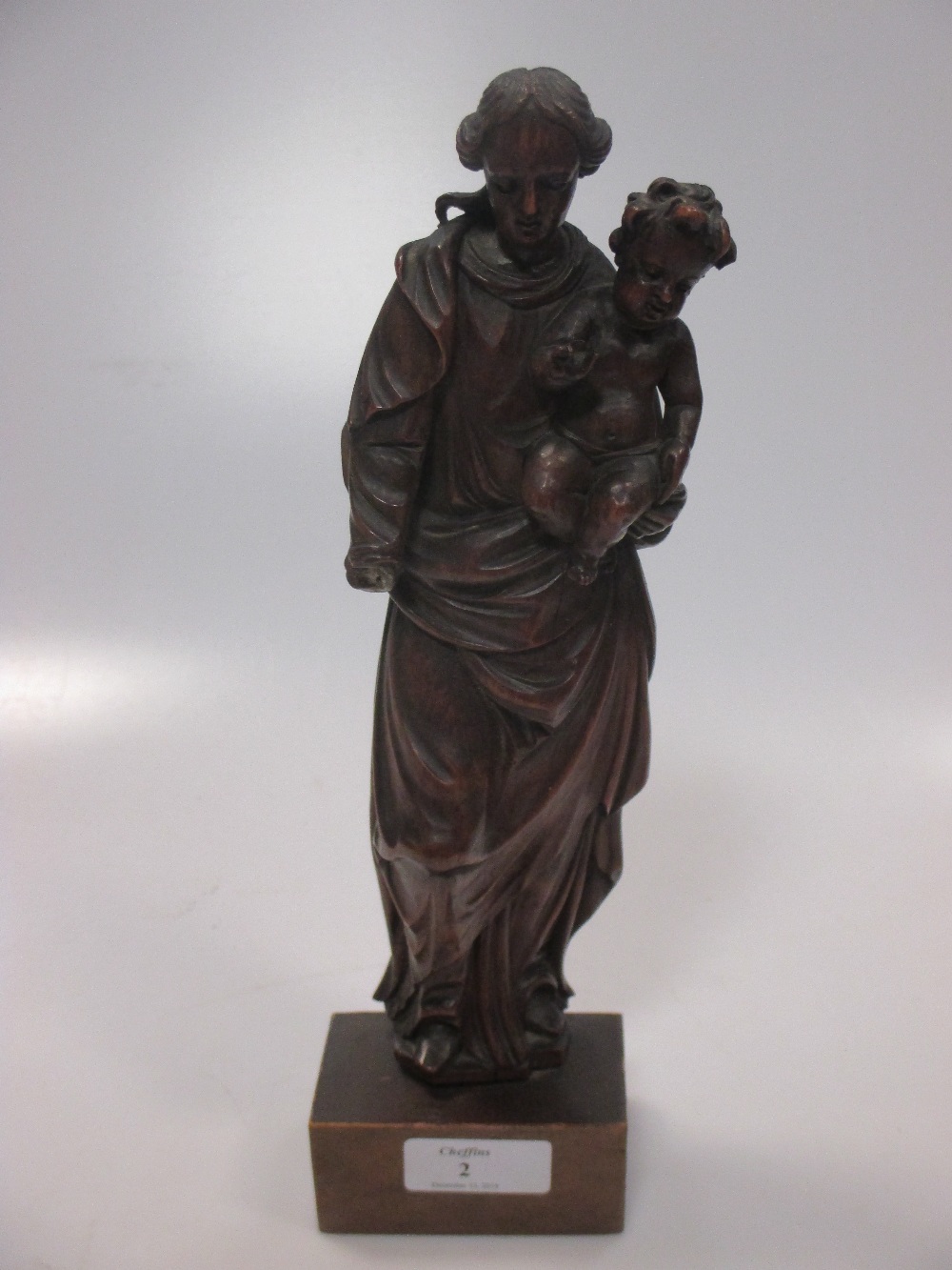 A carved wood virgin and child figure group, probably late 18th or early 19th century, on stand 27.