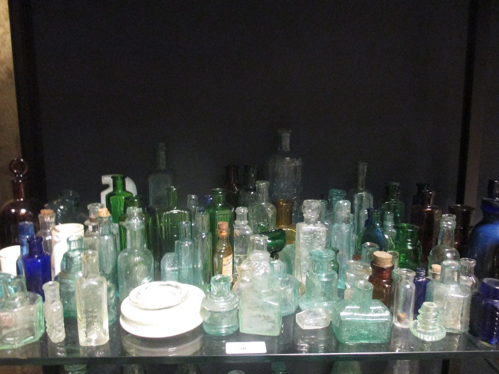 A very large quantity of glass bottles of varying sizes, salt glazed jars and various oil lamps - Image 2 of 11