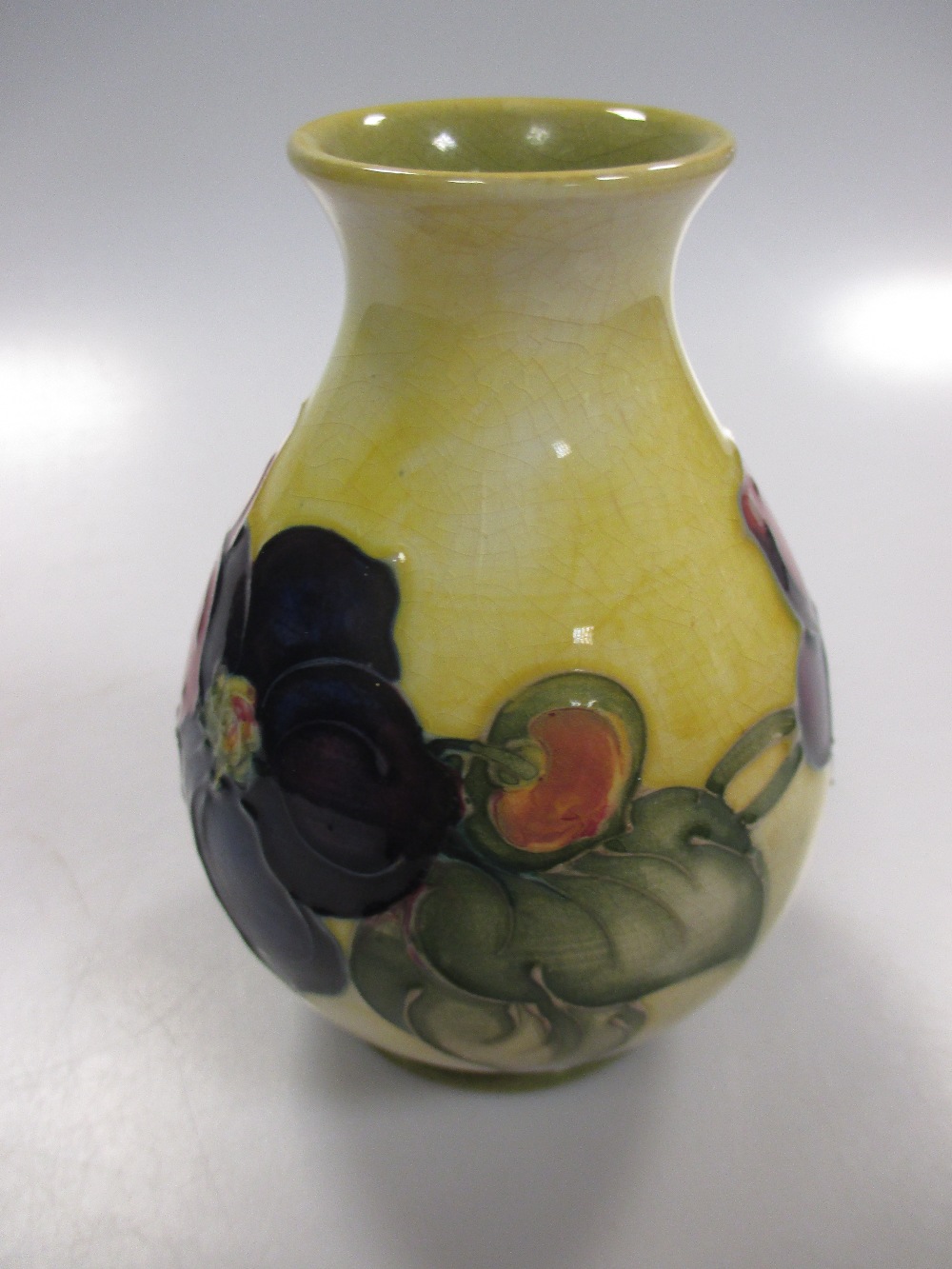 A Moorcroft vase, the yellow ground with clematis flowers, 11cm high - Image 2 of 4