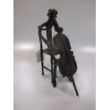 A bronze figure of a cellist, 23cm high