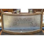 A Victorian pine framed bowed frosted glass panel, "BRANDIES" 70 x 120cm