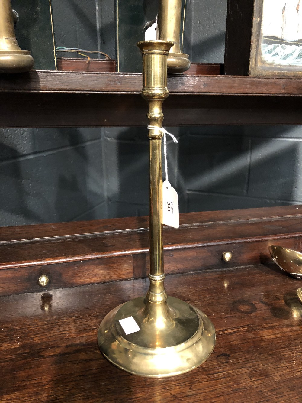 A 19th century decorative brass and iron cream skimmer, together with a pair of slender brass - Image 6 of 7
