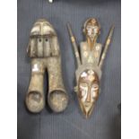 Two African tribal masks, 66cm high and 58cm high