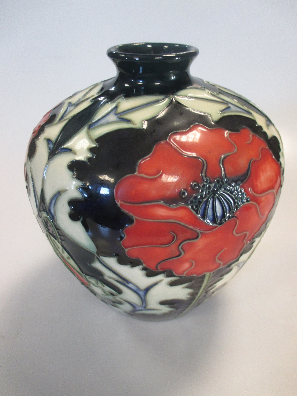 A Moorcroft vase, 18cm high