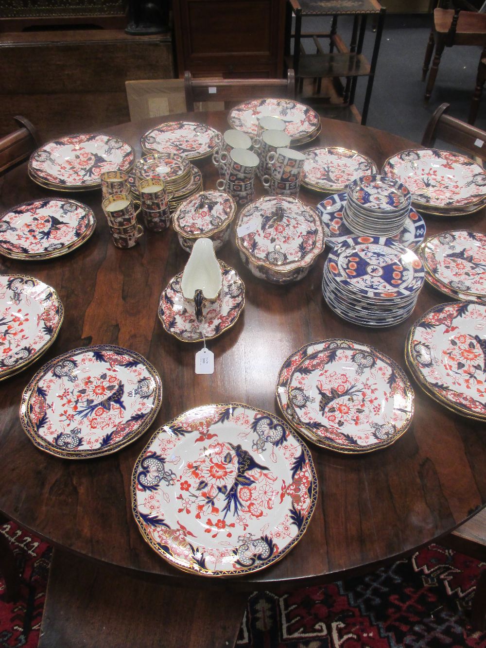 A Royal Crown Derby Imari 3590 pattern dinner service for six comprising of dinner plates, bowls,