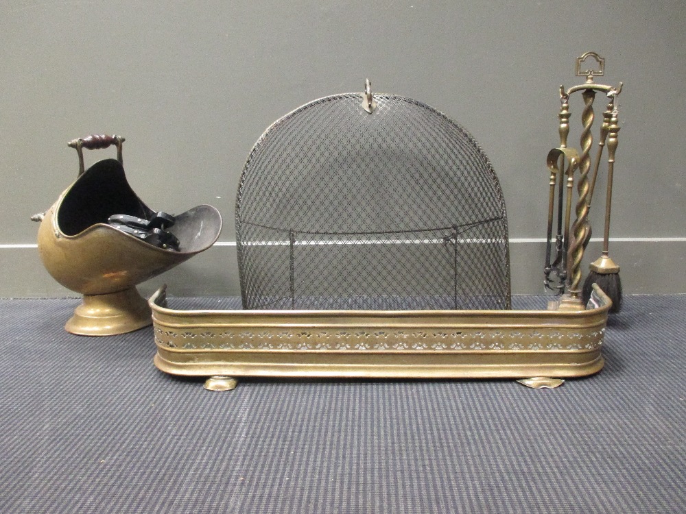 A brass coal scuttle, fire tools and spark guard etc