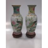 Two similar Chinese vases, 20th century, decorated with peacocks and famille rose decoration, 26cm